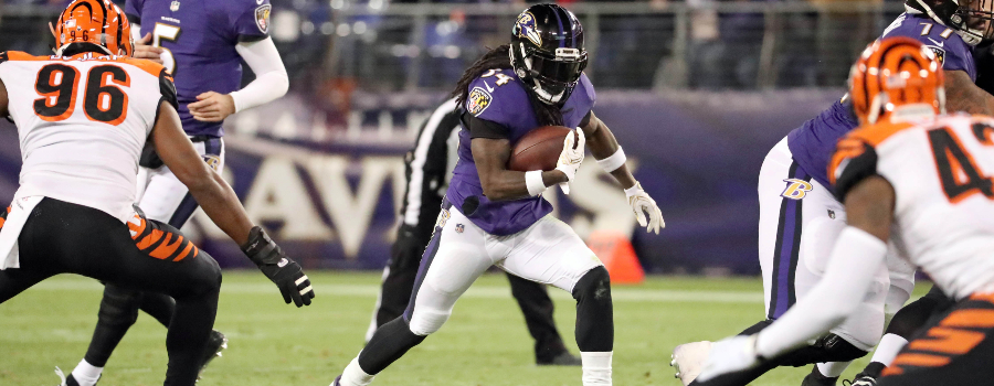 Baltimore Ravens running back Alex Collins (34) runs for a gain against the Cincinnati Bengals at M&T Bank Stadium.