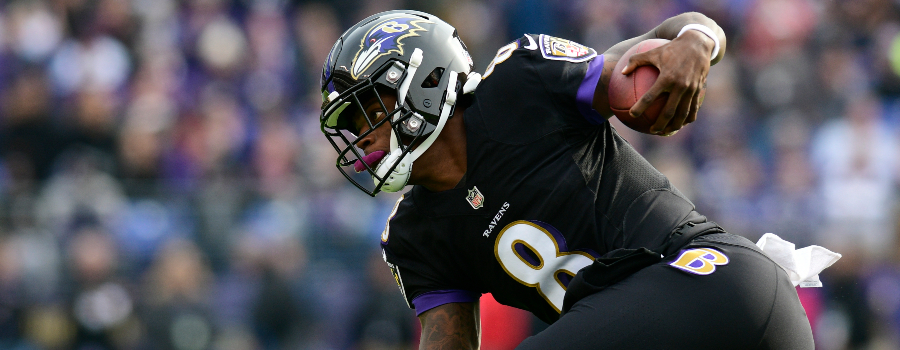 Baltimore Ravens quarterback Lamar Jackson (8) dives for extra yards during the first first quarter against the Cincinnati Bengals at M&T Bank Stadium.