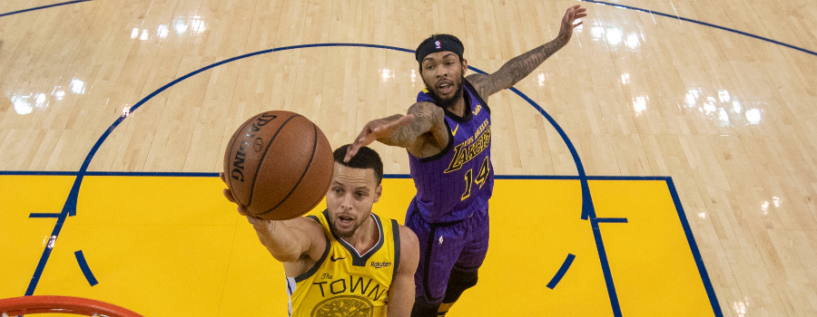 Golden State Warriors guard Stephen Curry (30) shoots the basketball against Los Angeles Lakers forward Brandon Ingram (14) during the first half at Oracle Arena.