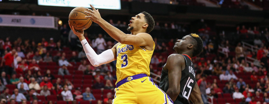 Los Angeles Lakers guard Josh Hart (3) attempts to score as Houston Rockets center Clint Capela (15) defends during the game at Toyota Center.