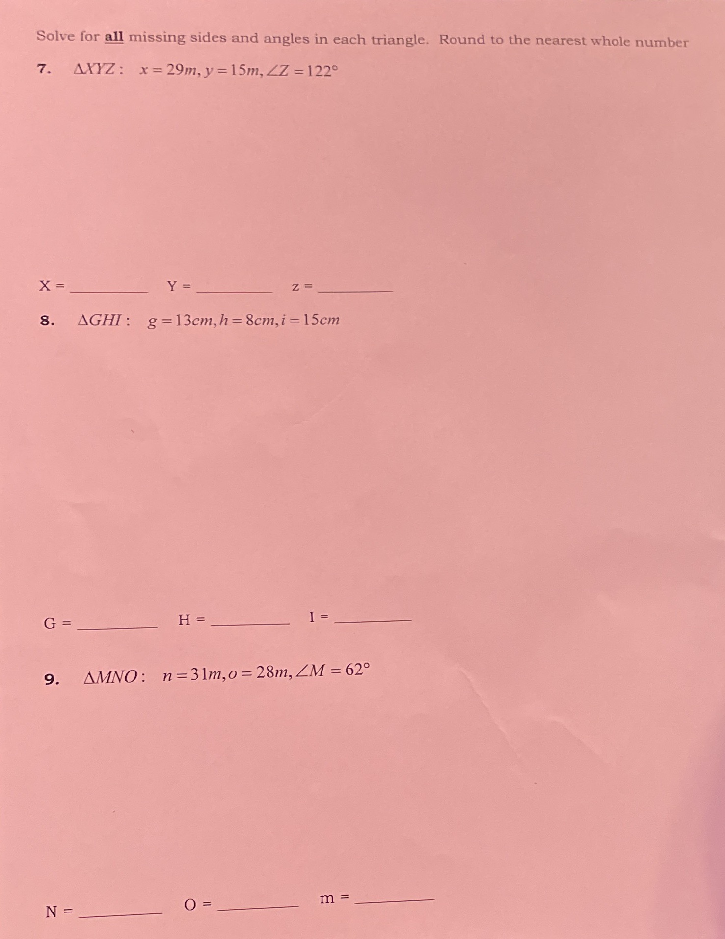 all missing sides and angles in each triangle. Round to the nearest