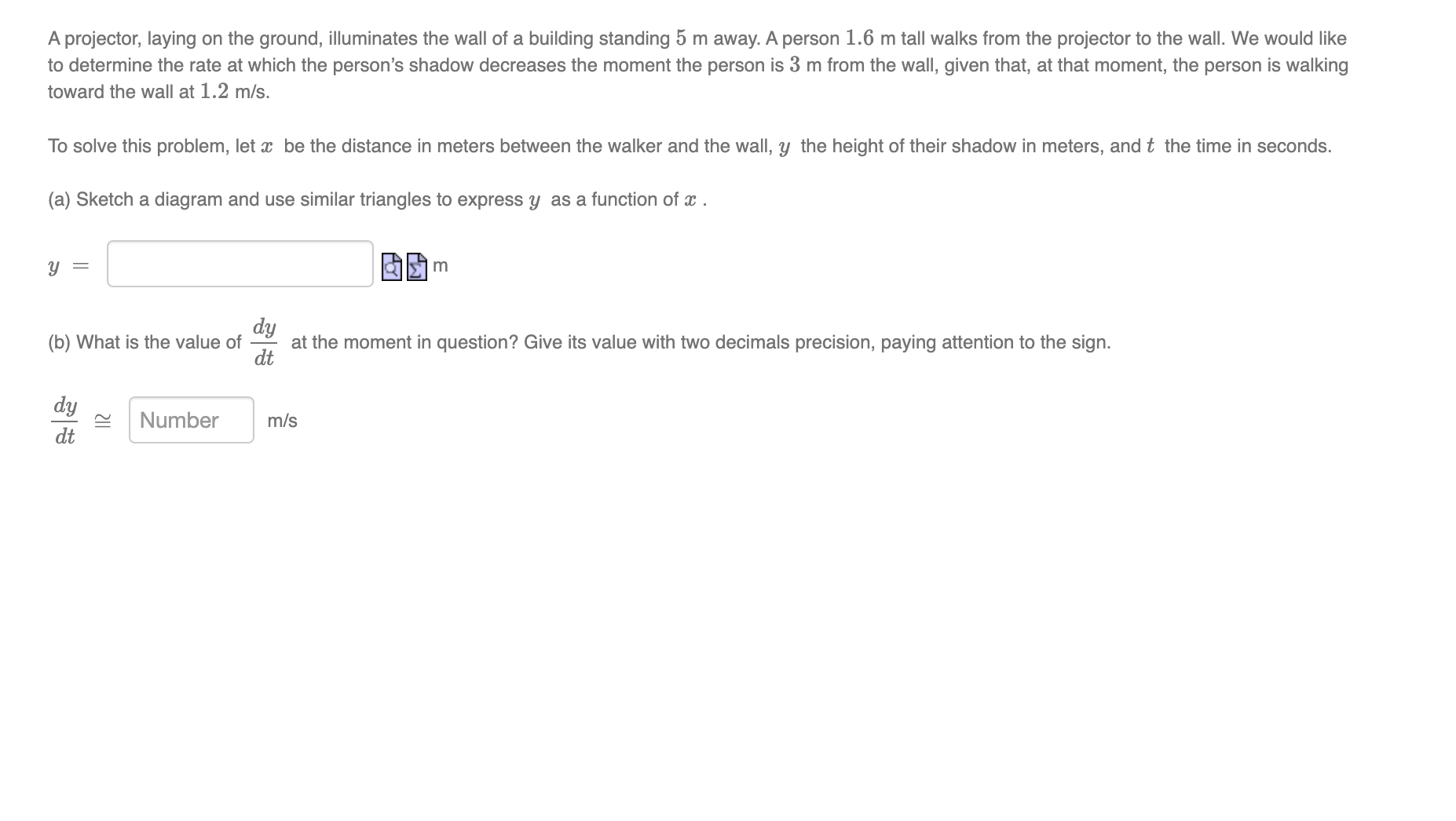 Aprojector, laying on the ground, illuminates the wall at a building