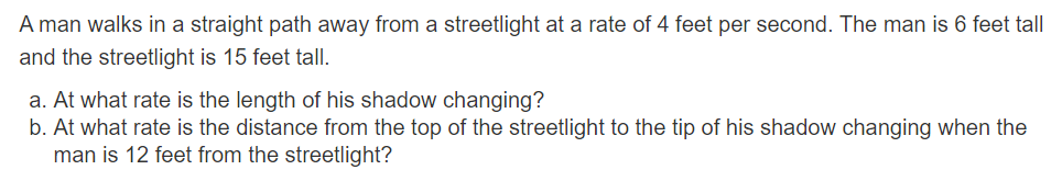 man walks in a straight path away from a streetlight at a