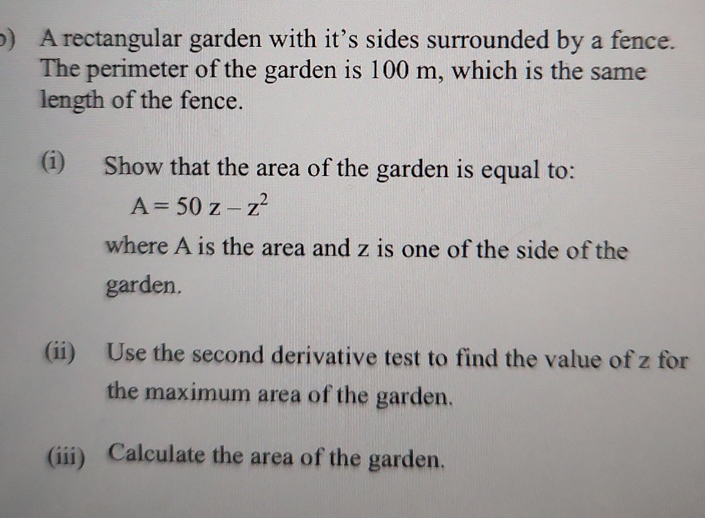 A rectangular garden with it's sides surrounded by a fence. The