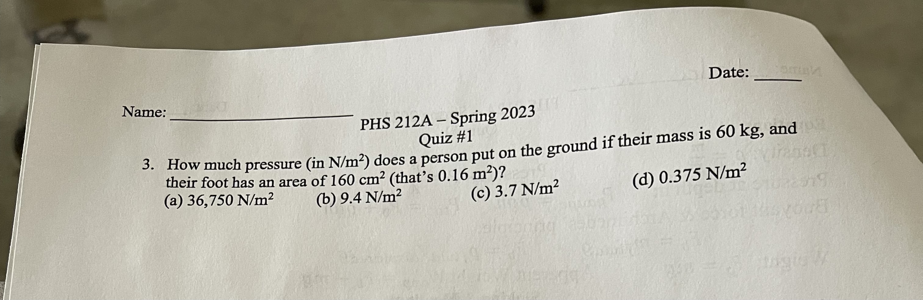 much pressure (in N/m2) does a person put on the ground if