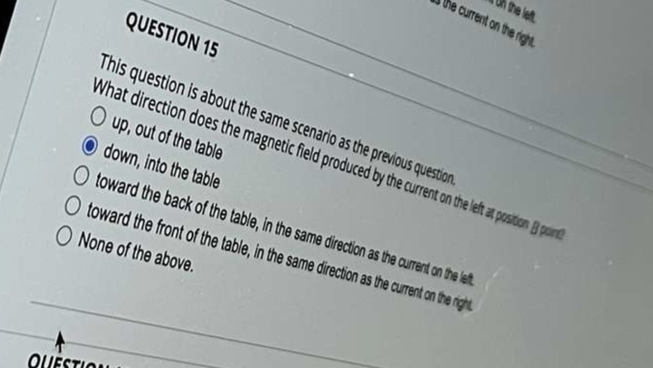 current on the let. O toward the front of the table, in