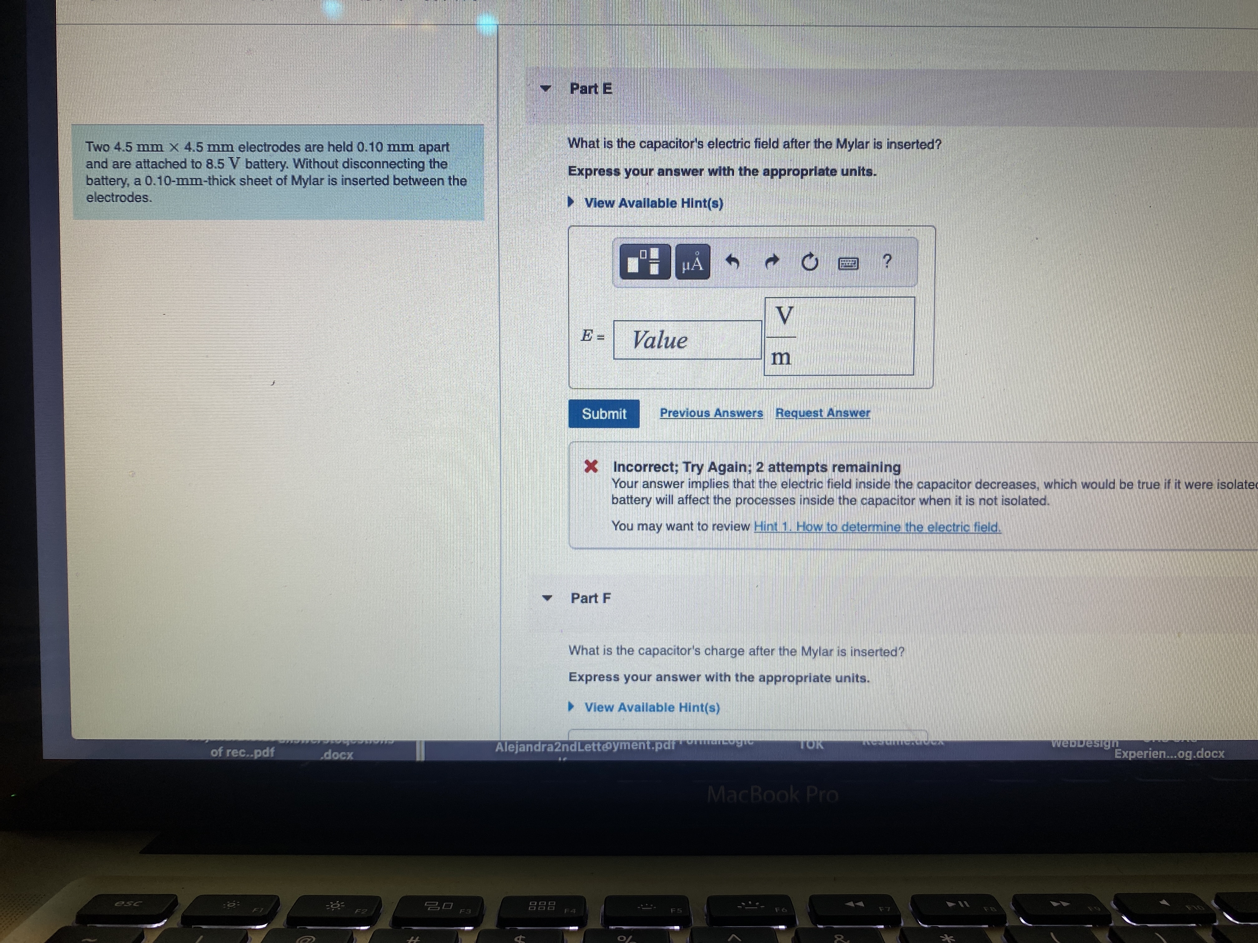 0.10 mm apart What is the capacitor's electric field after the Mylar