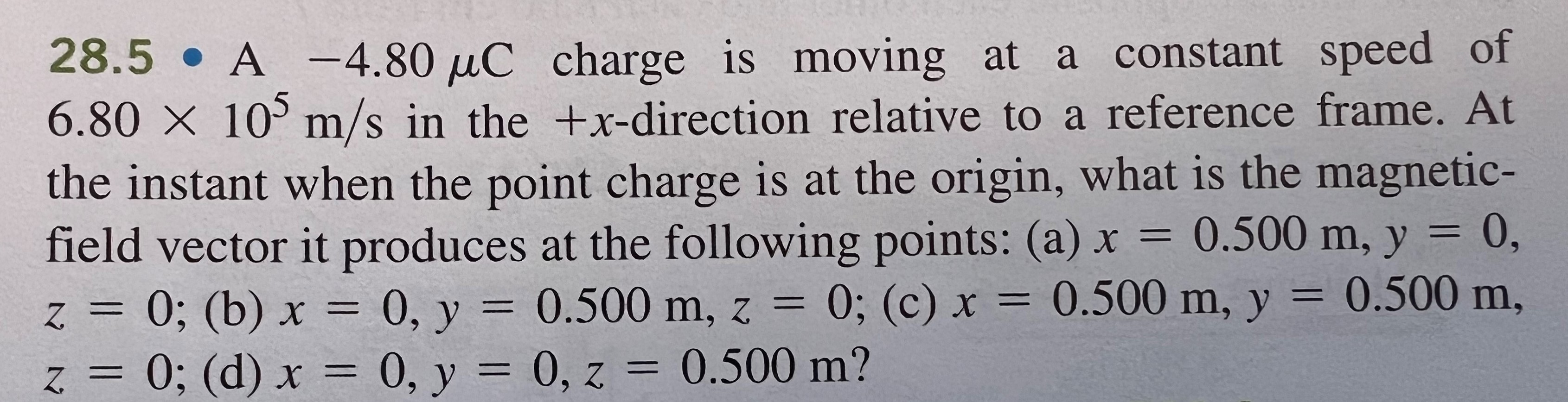  28.5 . A -4.80 uC charge is moving at a constant
