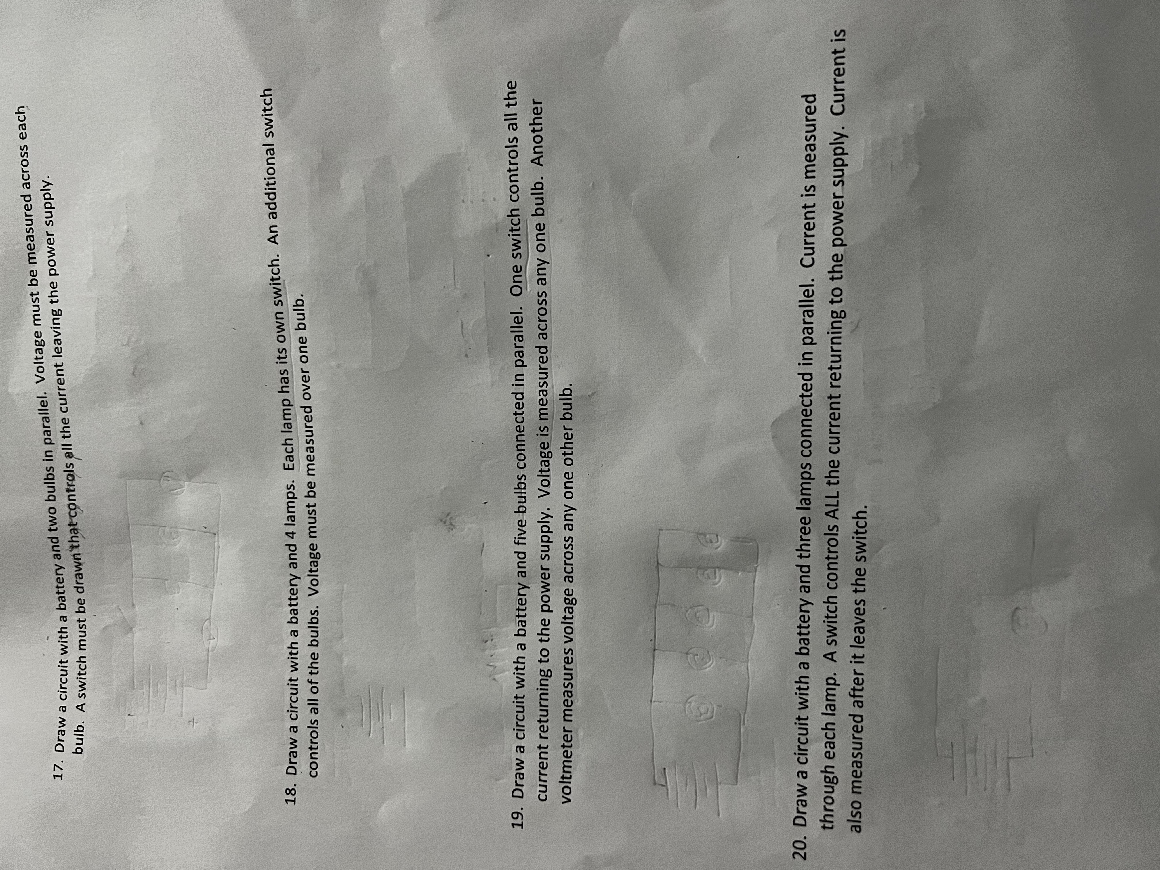  17. Draw a circuit with a battery and two bulbs in