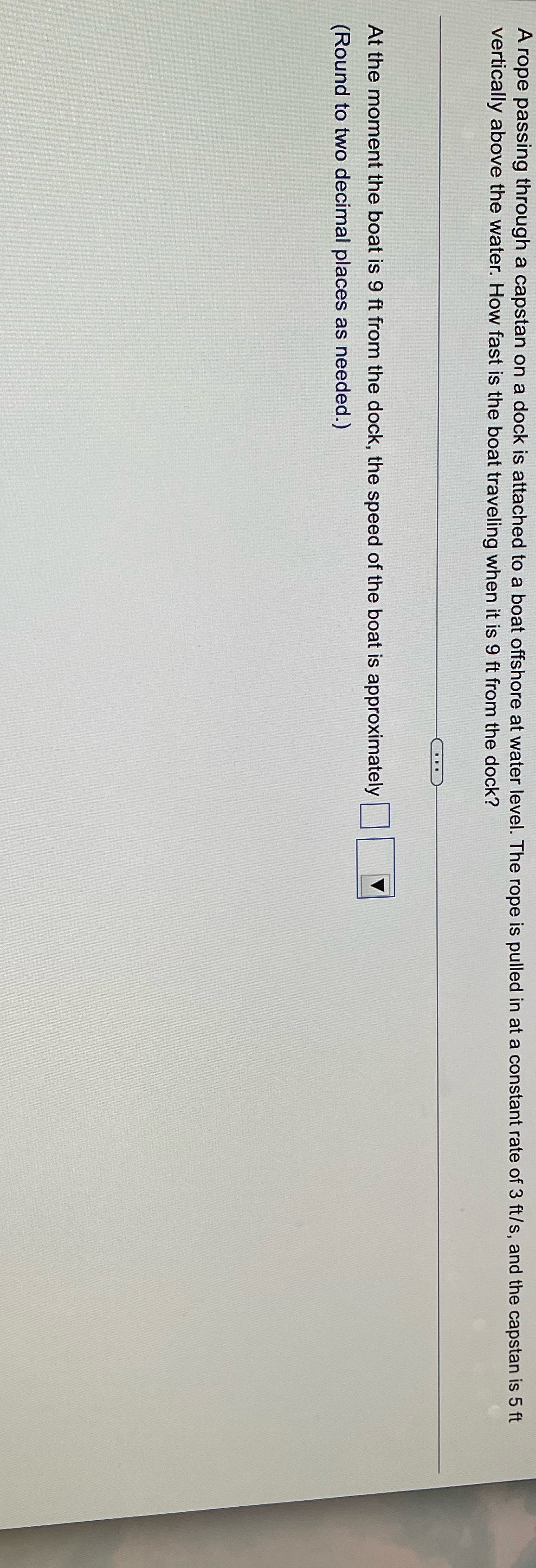 A rope passing through a capstan on a dock is attached