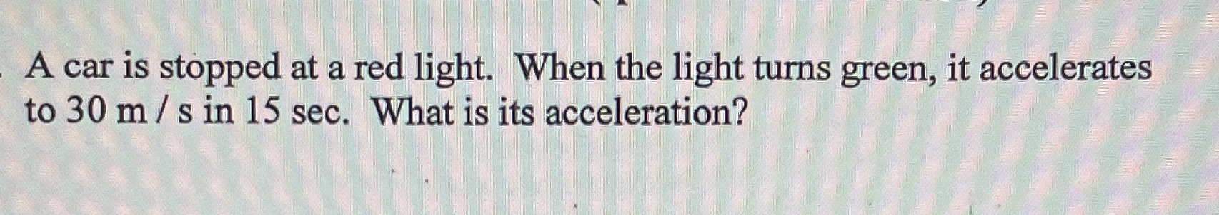 A car is stopped at a red light. When the light