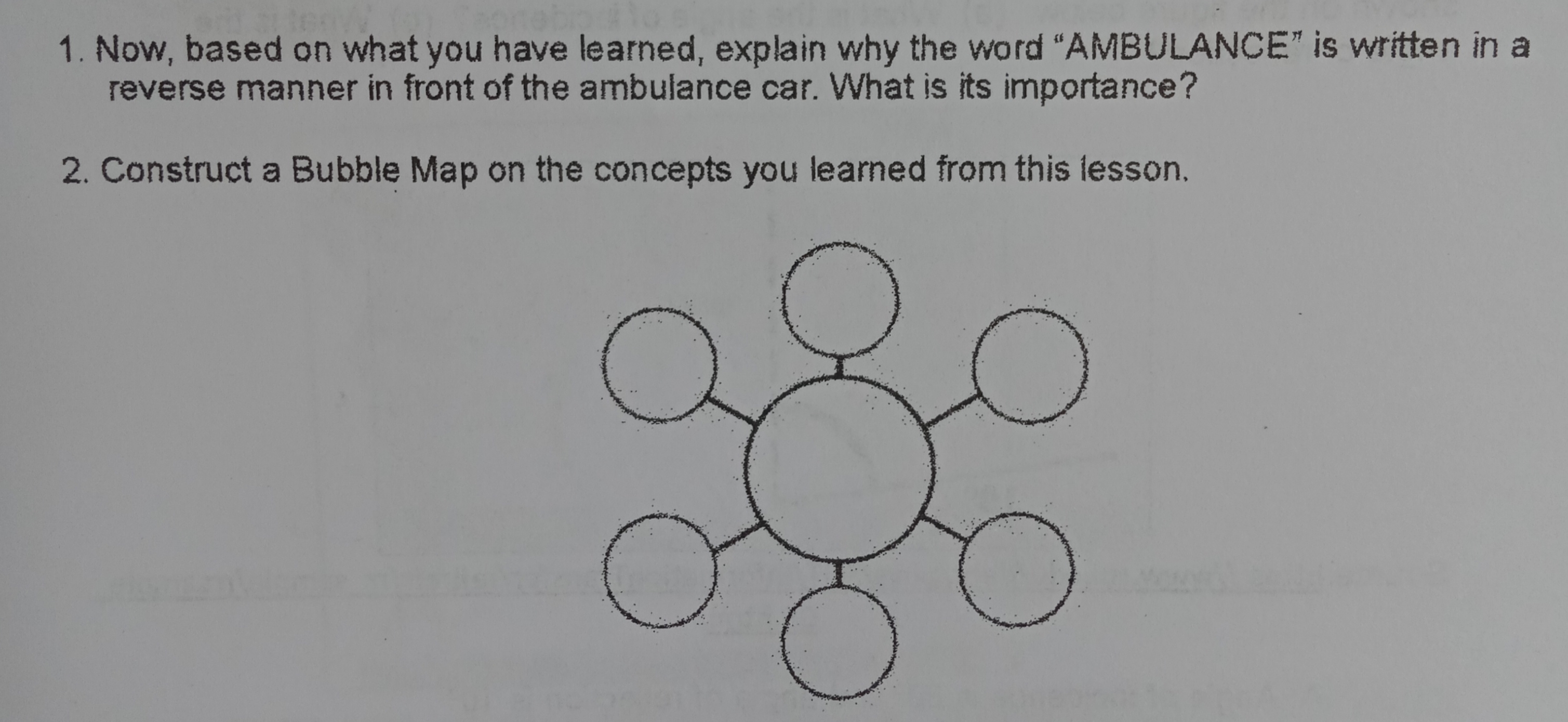 word "AMBULANCE" is written in a reverse manner in front of the