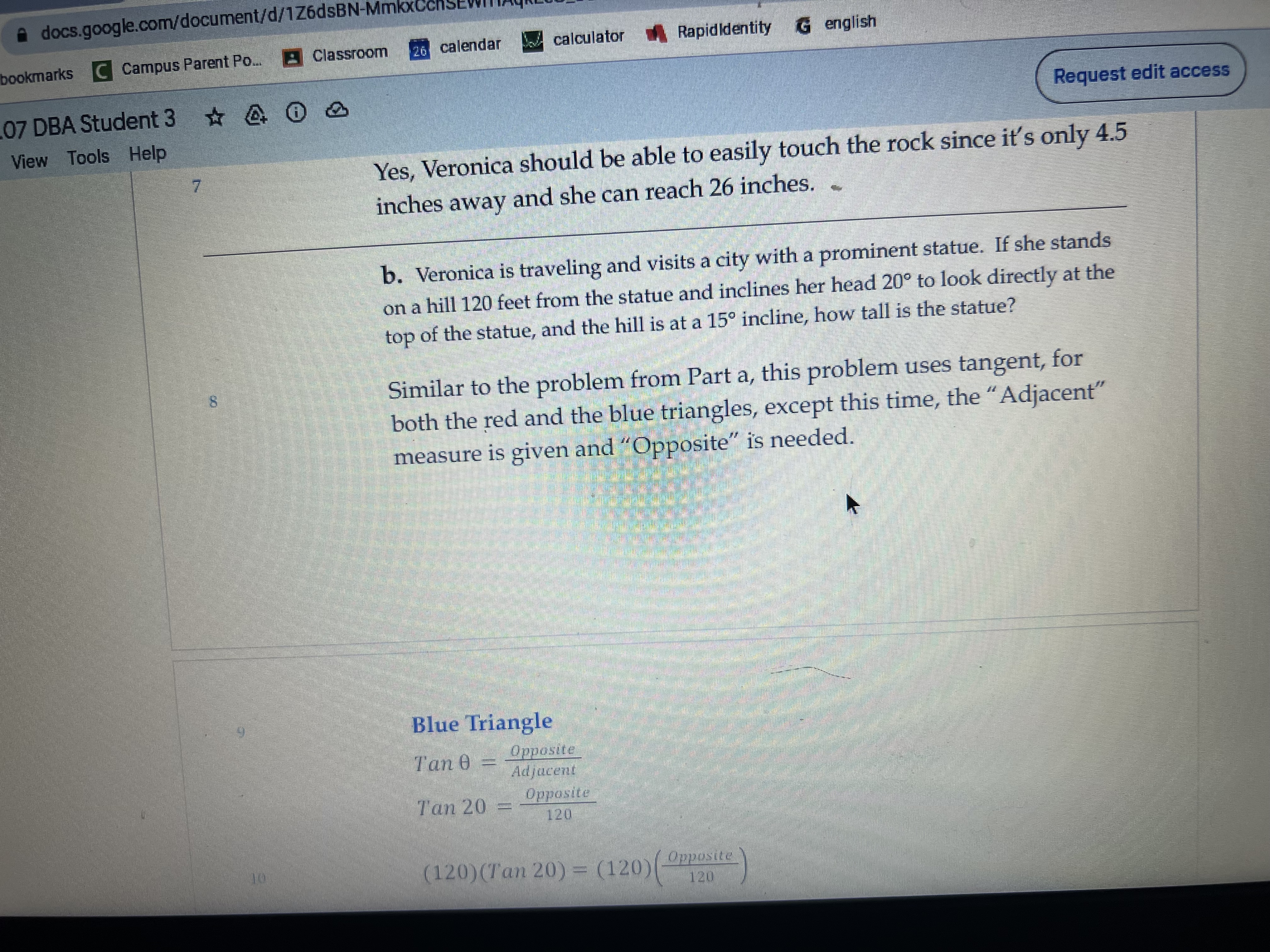 and inclines her head 20 to look directly at the top of