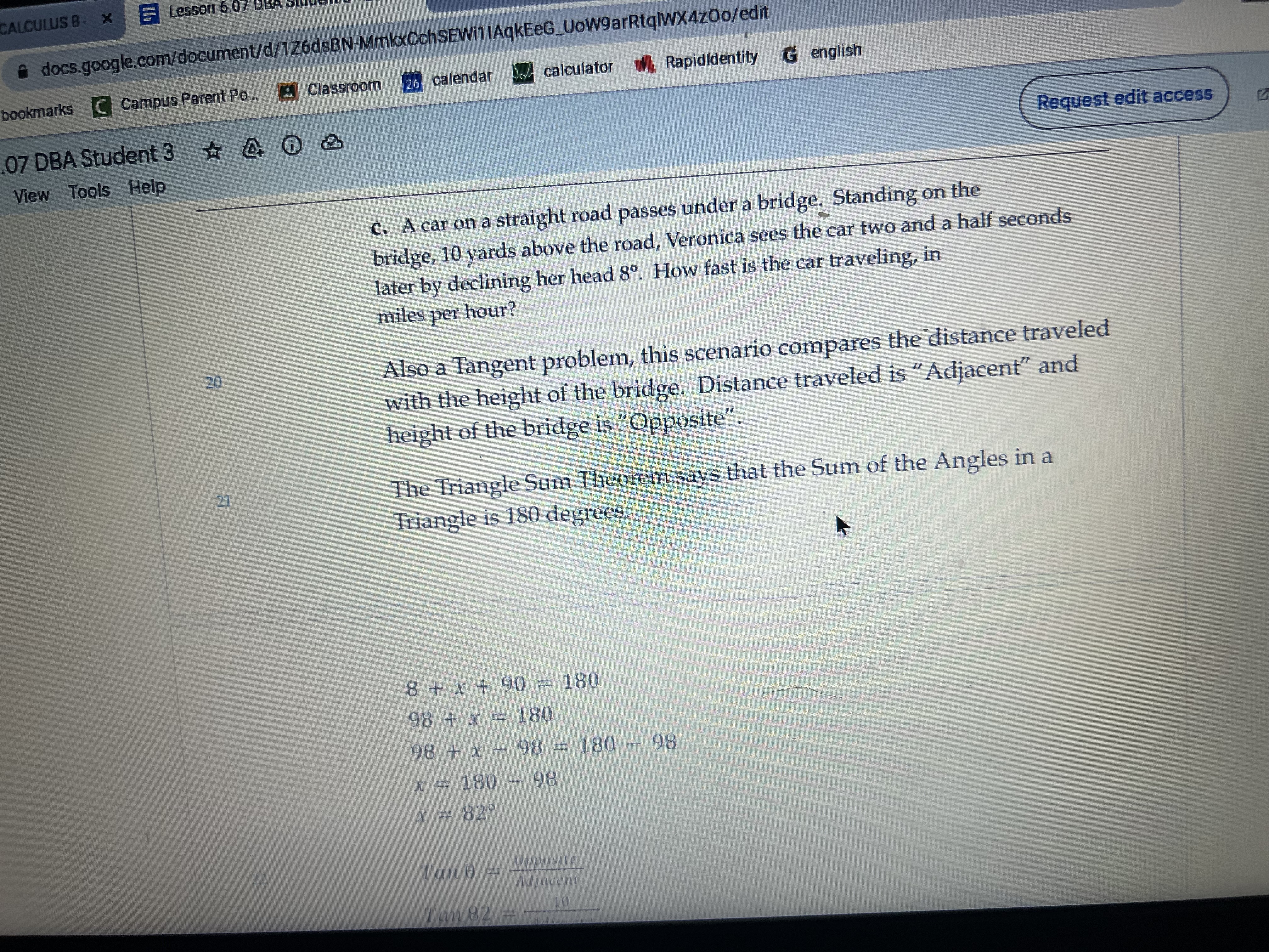 is the statue? C. A car on a straight road passes under