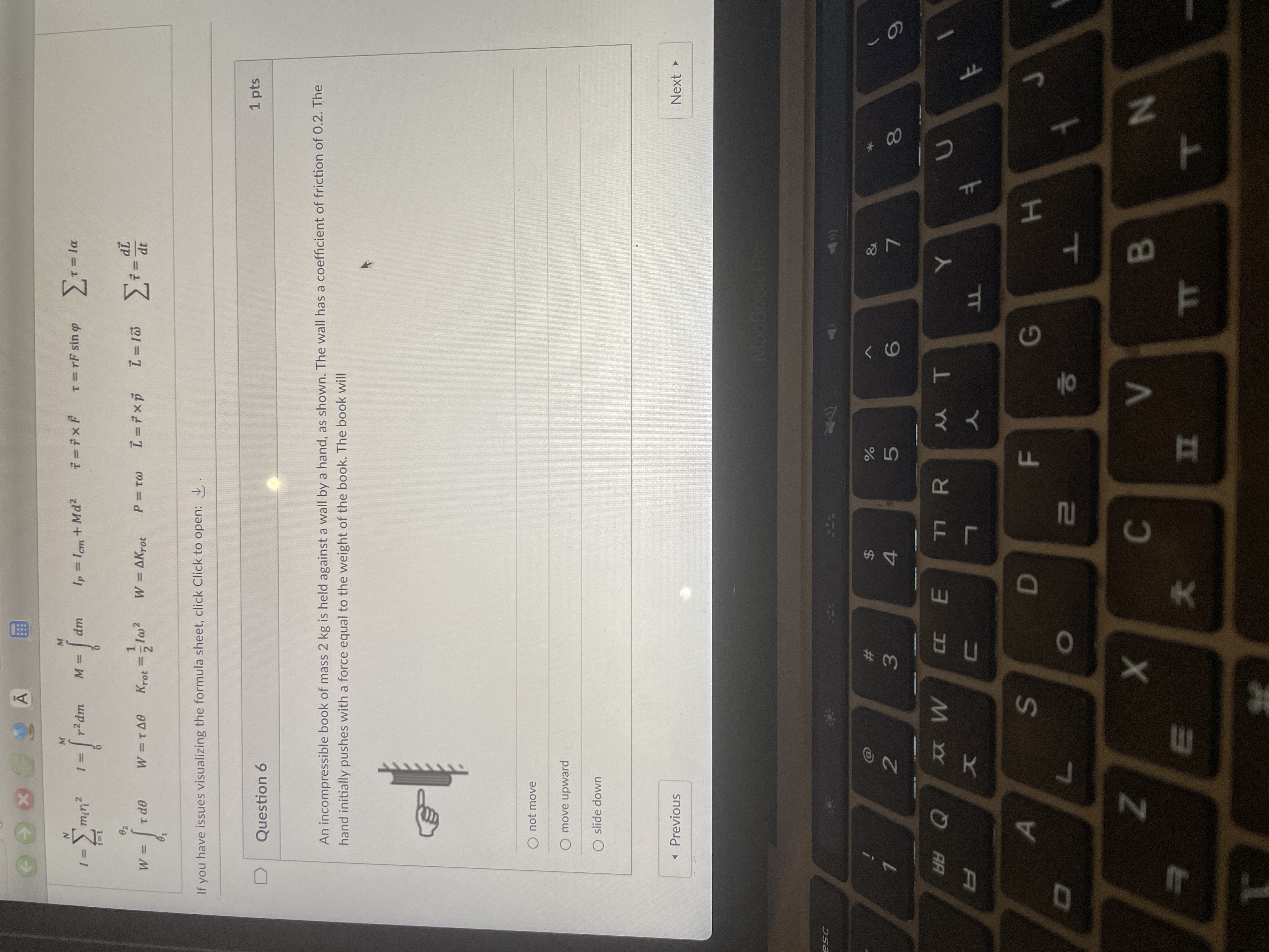 An incompressible book of mass 2 kg is held against a wall