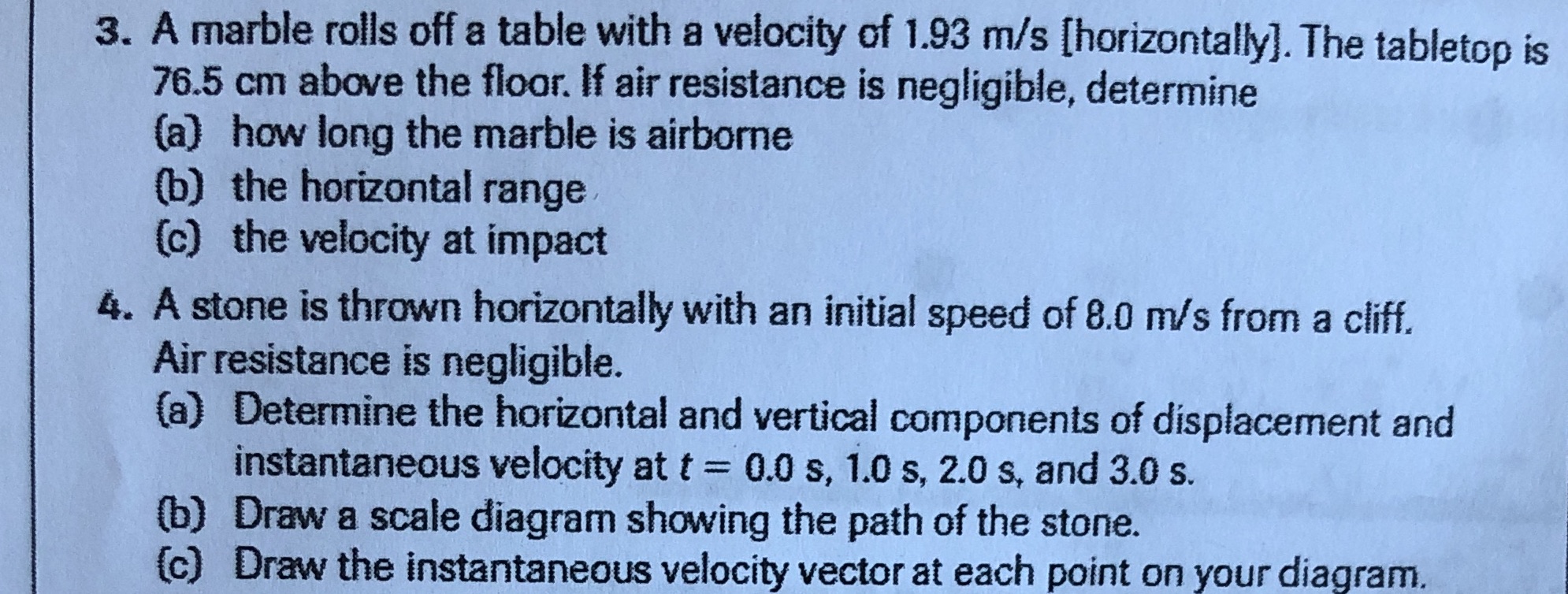 3. A marble rolls off a table with a velocity of