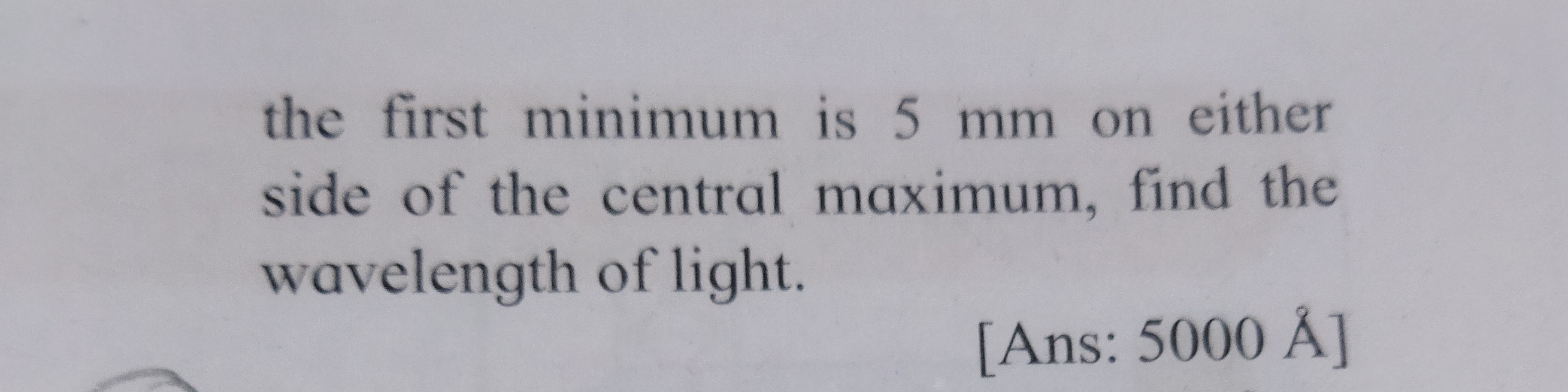 placed at a distance of 2 m from the lens to obtain