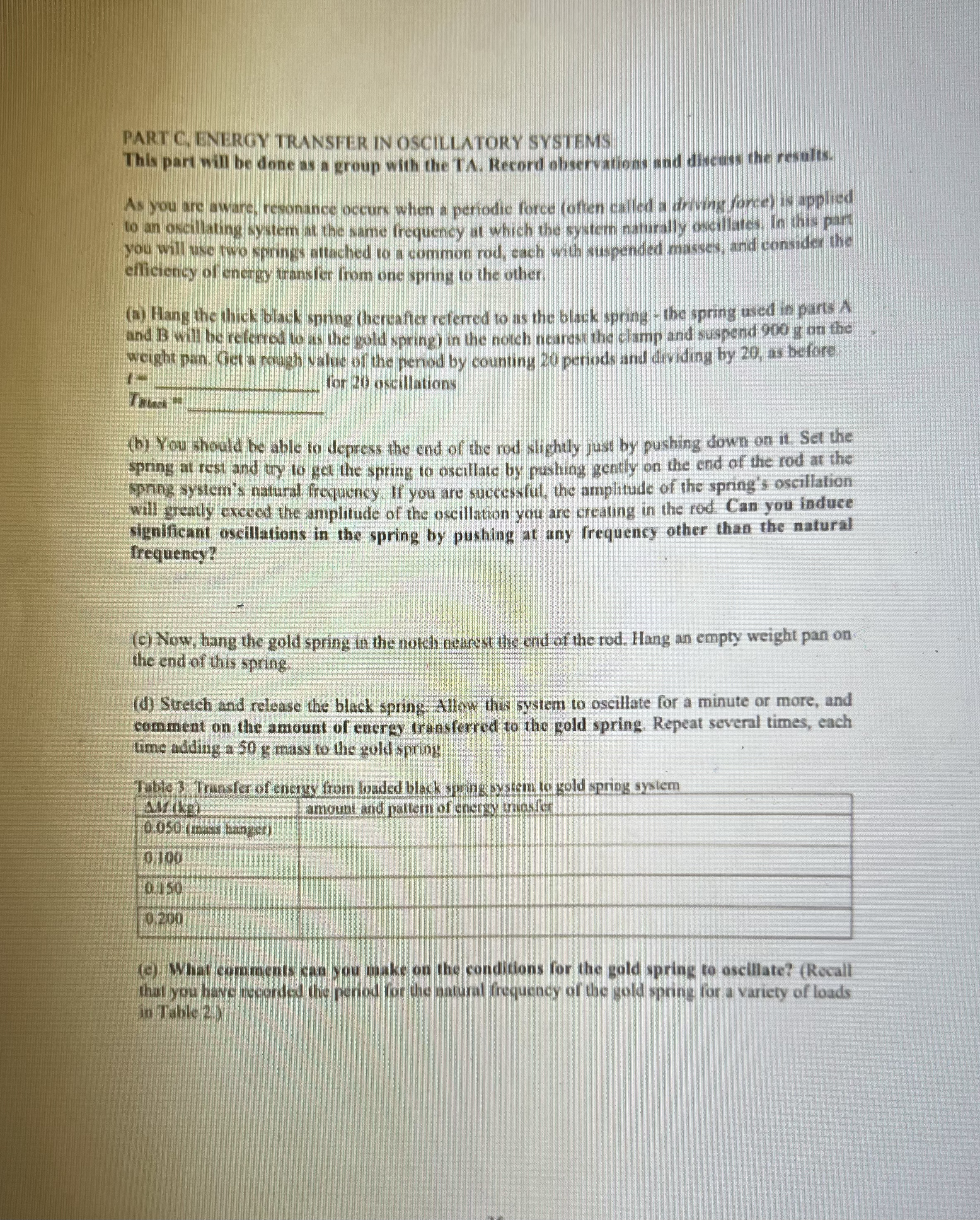 just the mass hanger. Set the mass oscillating without causing the spring