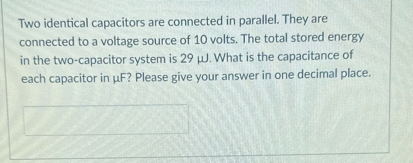  Two identical capacitors are connected in parallel. They are connected to