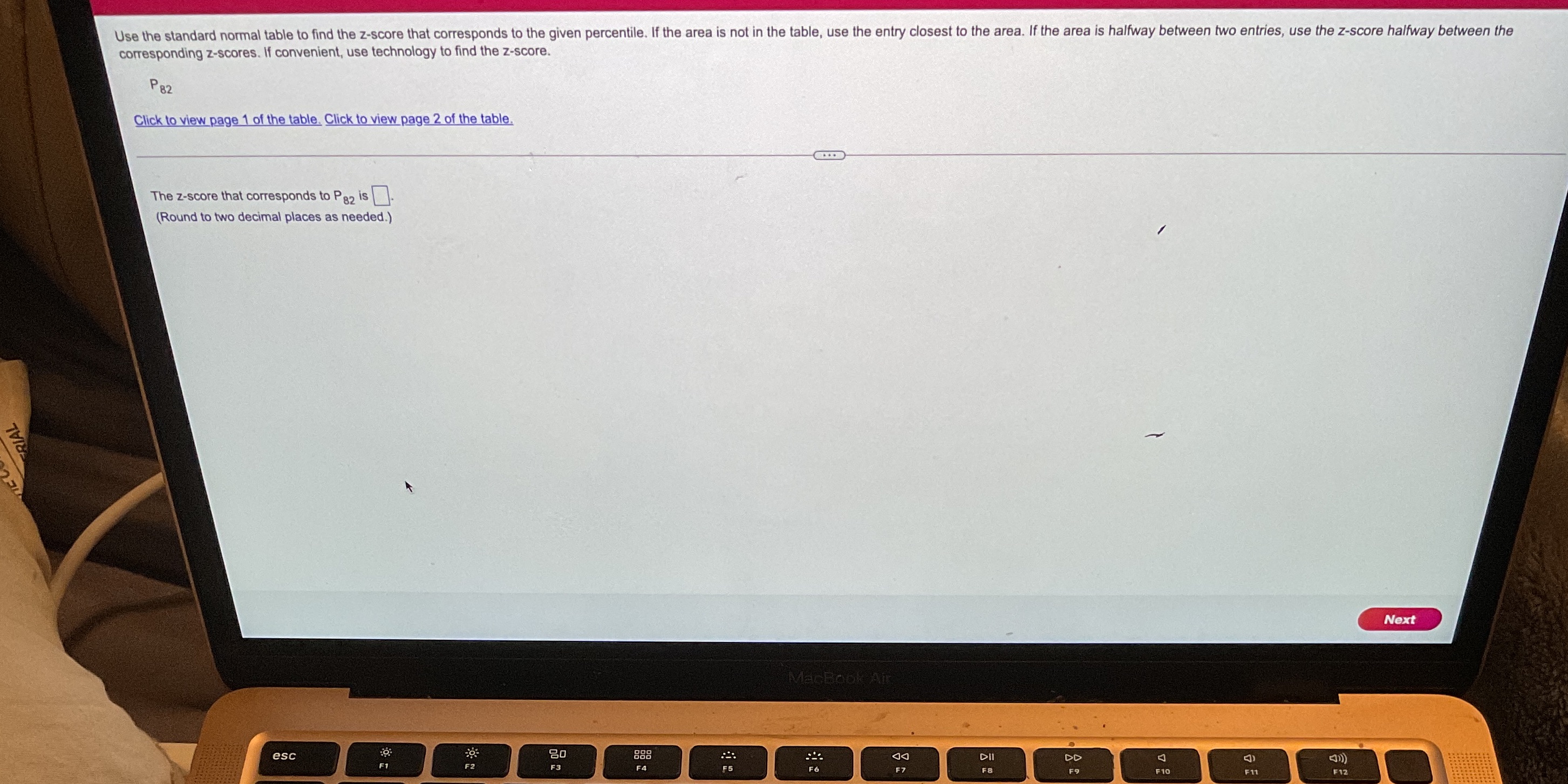 please help Use the standard normal table to find the z-score that