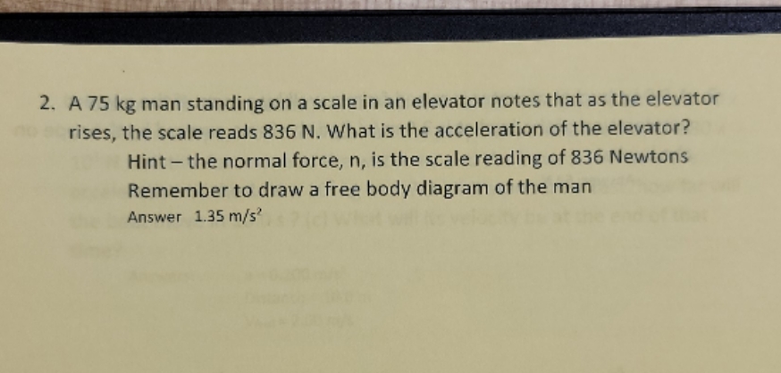 please help. 2. A 75 kg man standing on a scale in