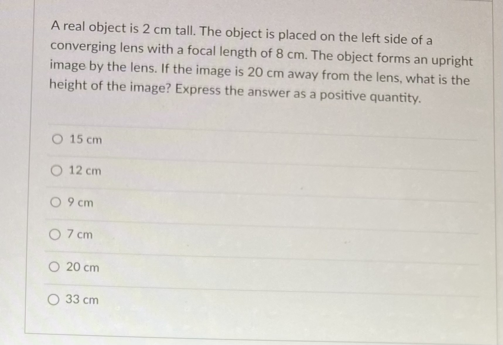 A real object is 2 cm tall. The object is placed