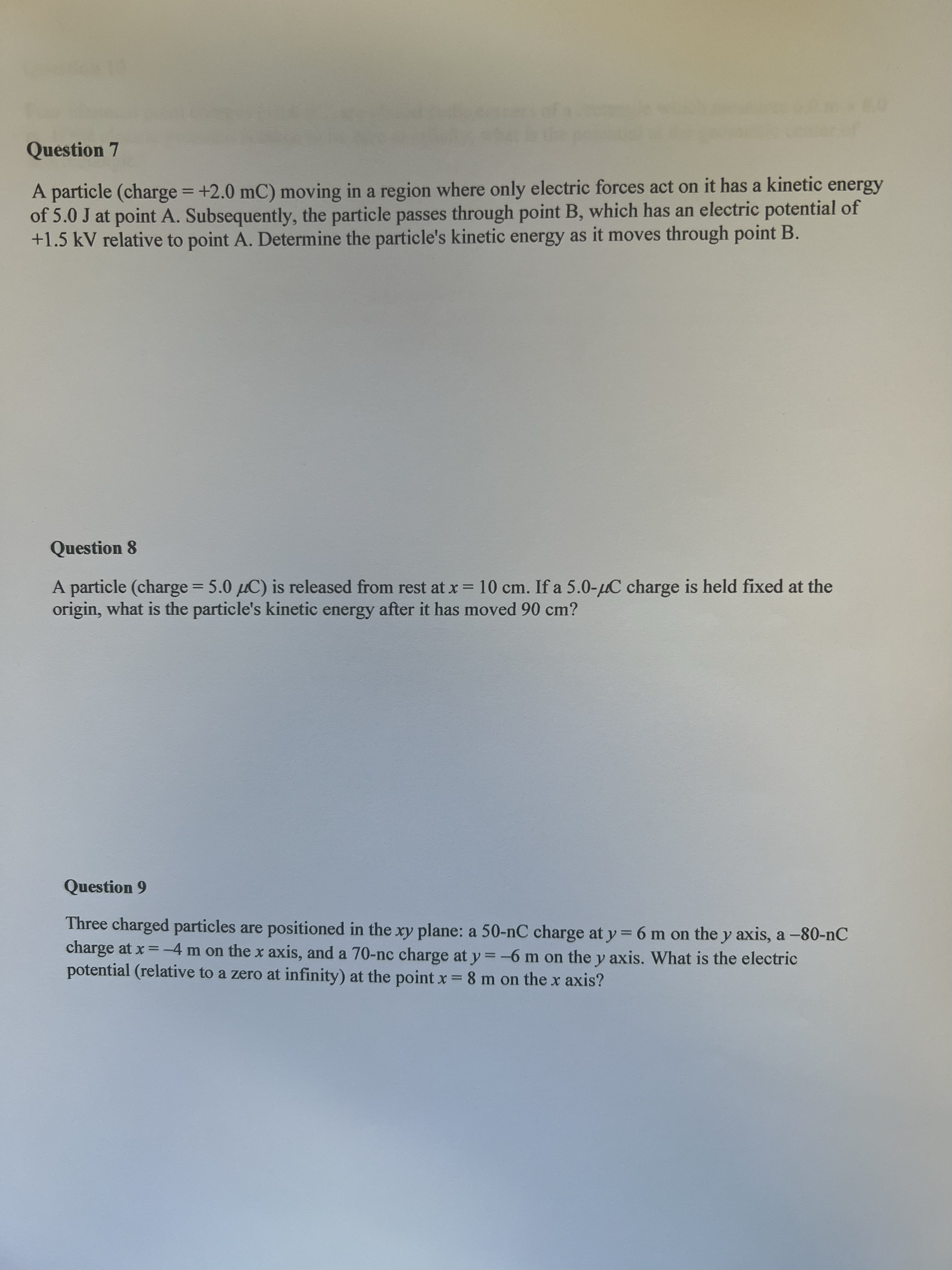 particle (charge = -50 uC) is placed on the x-axis at x