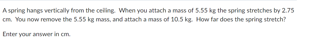 A spring hangs vertically from the ceiling. When you attach a