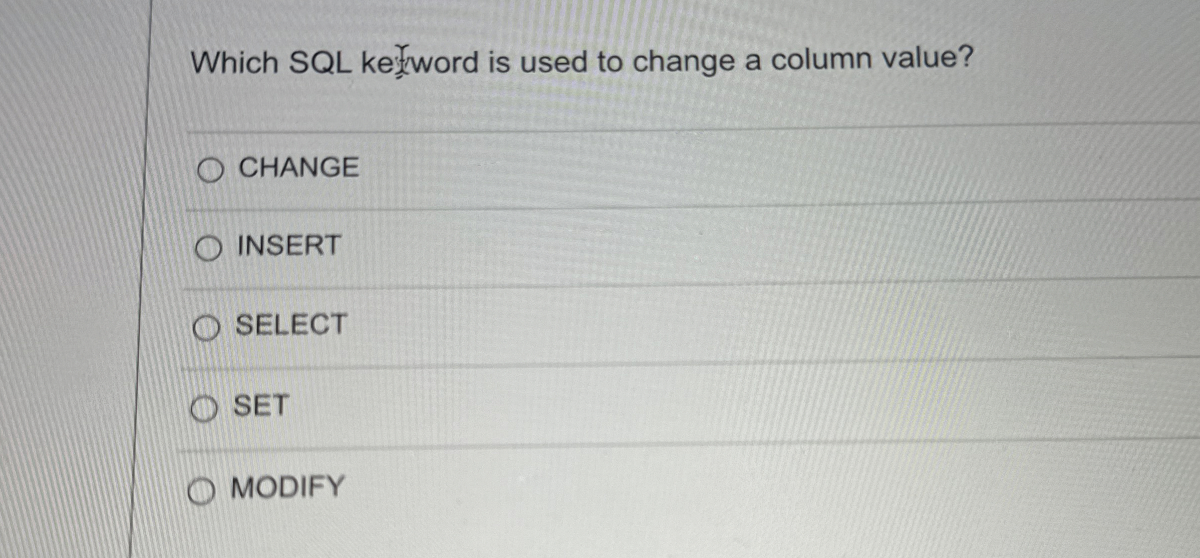  Which SQL ke word is used to change a column value?