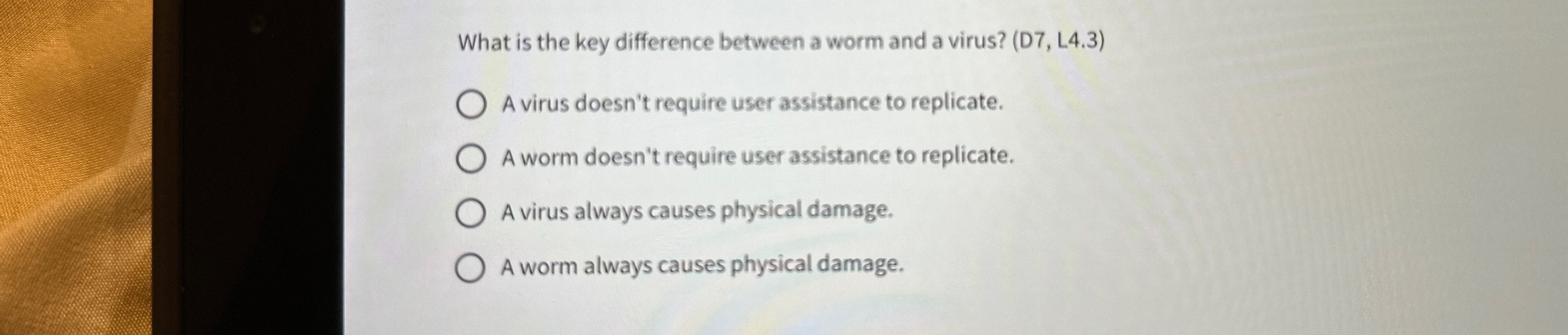  What is the key difference between a worm and a virus?