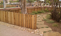 front yard fence stonework plants
