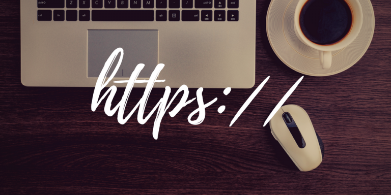 https:// with background image of a laptop keyboard, wireless mouse, and coffee mug on a wooden desk