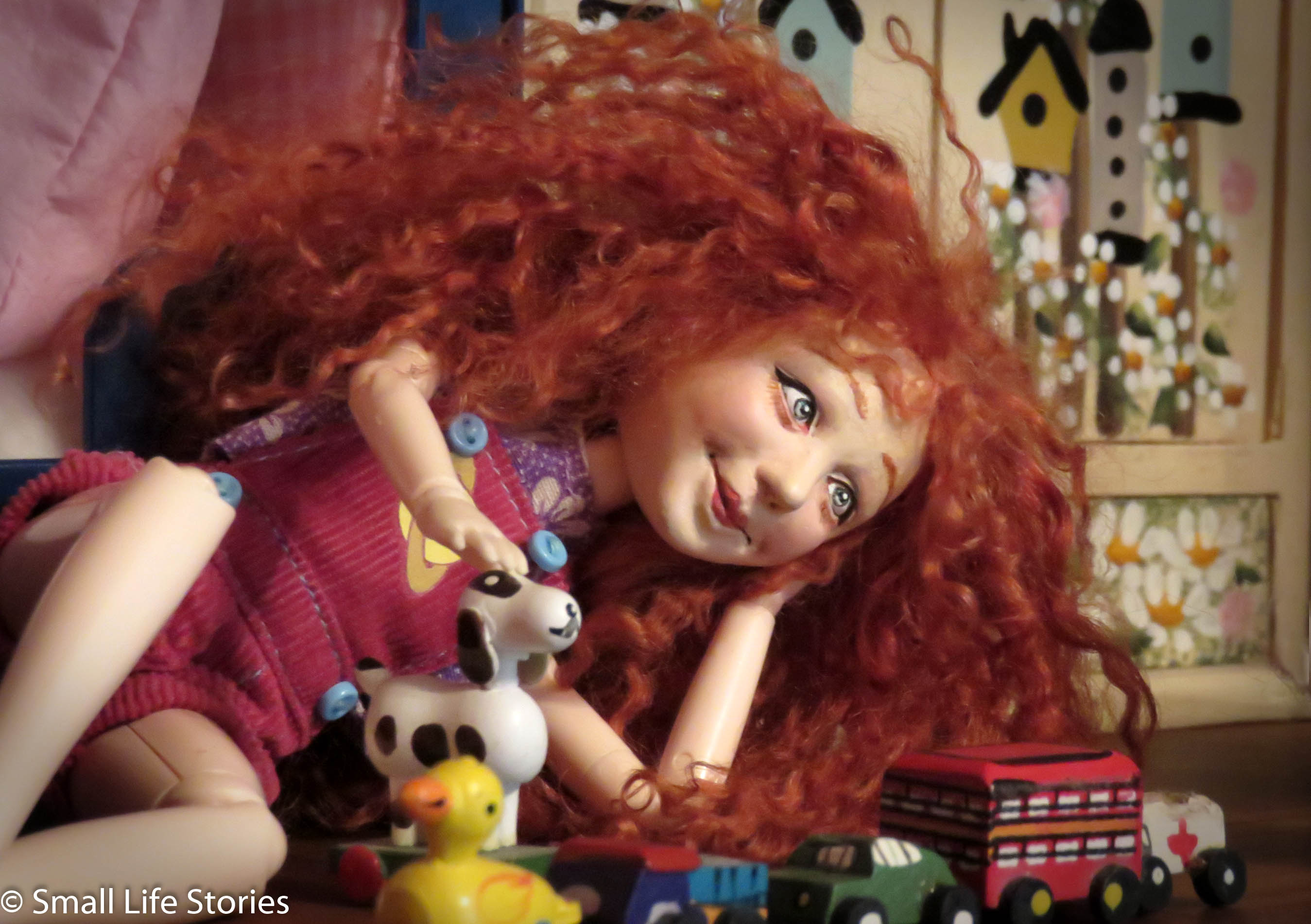 Rosie plays with her trains