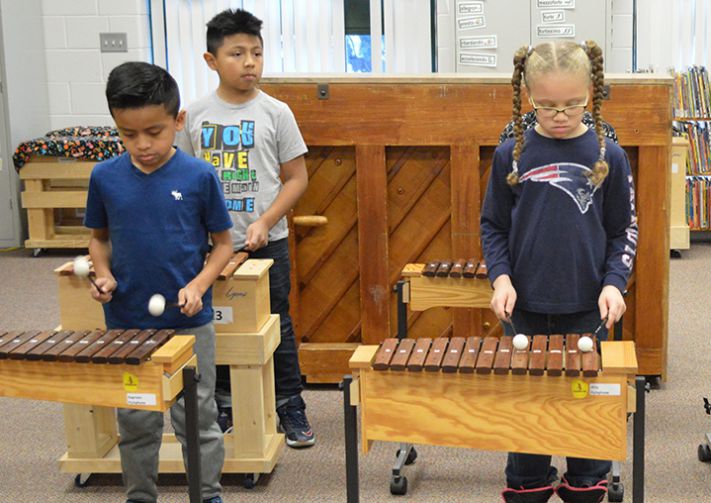 Students take turns on the xylophones