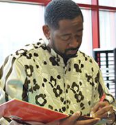 Author and educator Byron Garrett signs his children’s book, “There’s Greatness on the Inside,” following his presentation