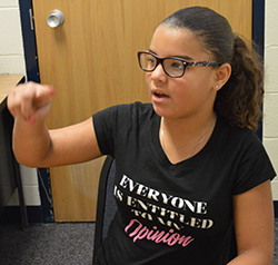 Fourth-grader Aubrianna Vernon practices spelling in the sky