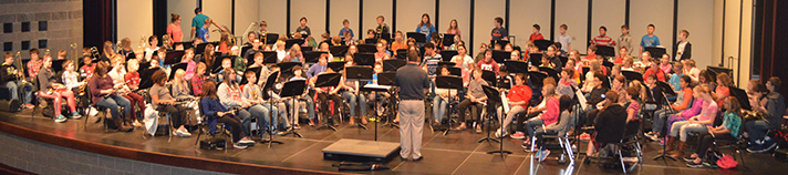 The Cedar Springs sixth-grade band gathers at the high school auditorium to rehearse for the holiday concert