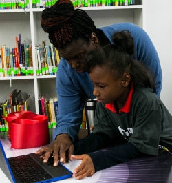 Tashaya Dannah checks out a new laptop with her mother, Latasha Gates