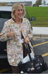 Nurse Amy by her car, which she drives from building to building throughout the school day