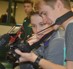 Students Matt Wilson, left, and Charlie Soucey review video footage