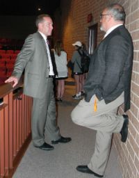 Kent County Assistant Prosecutor Chris Becker, left, talking with Scott Beckman, says there are no easy answers to preventing sexual assault