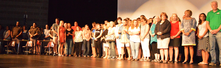 School staff, students and community members line the stage to unify in the fight against suicide