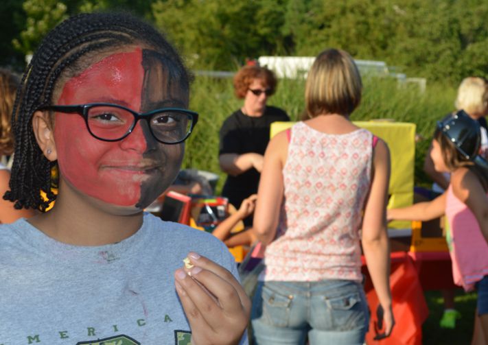 Kentwood Public Schools sixth-grader Olivia Openshaw celebrates in school colors