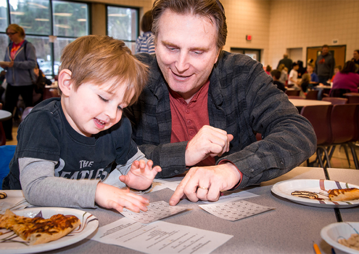 Riley and Doug Cnossen get their bingo cards ready