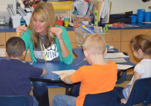 North Godwin Elementary kindergarten teacher Holly Vostad reads with students
