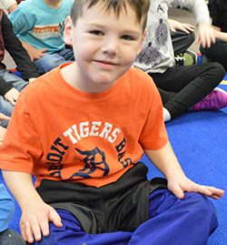 Kindergartner Sullivan Johnson rubs his legs, a calming technique taught through the Social Thinking curriculum