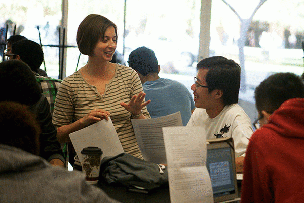 Kenji Wong, an international transfer student from Malaysia, discusses the class materials with Izabela Uscinski during class. (Photo by Ryan Liu)