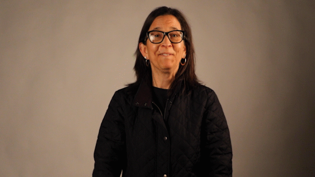 Stacy Steggs, assistant lecturer of special education Deaf and Hard of Hearing, signs &quot;Hello&quot; in American Sign Language. Steggs was born Deaf, and she learned ASL from attending the Nebraska School for the Deaf.  