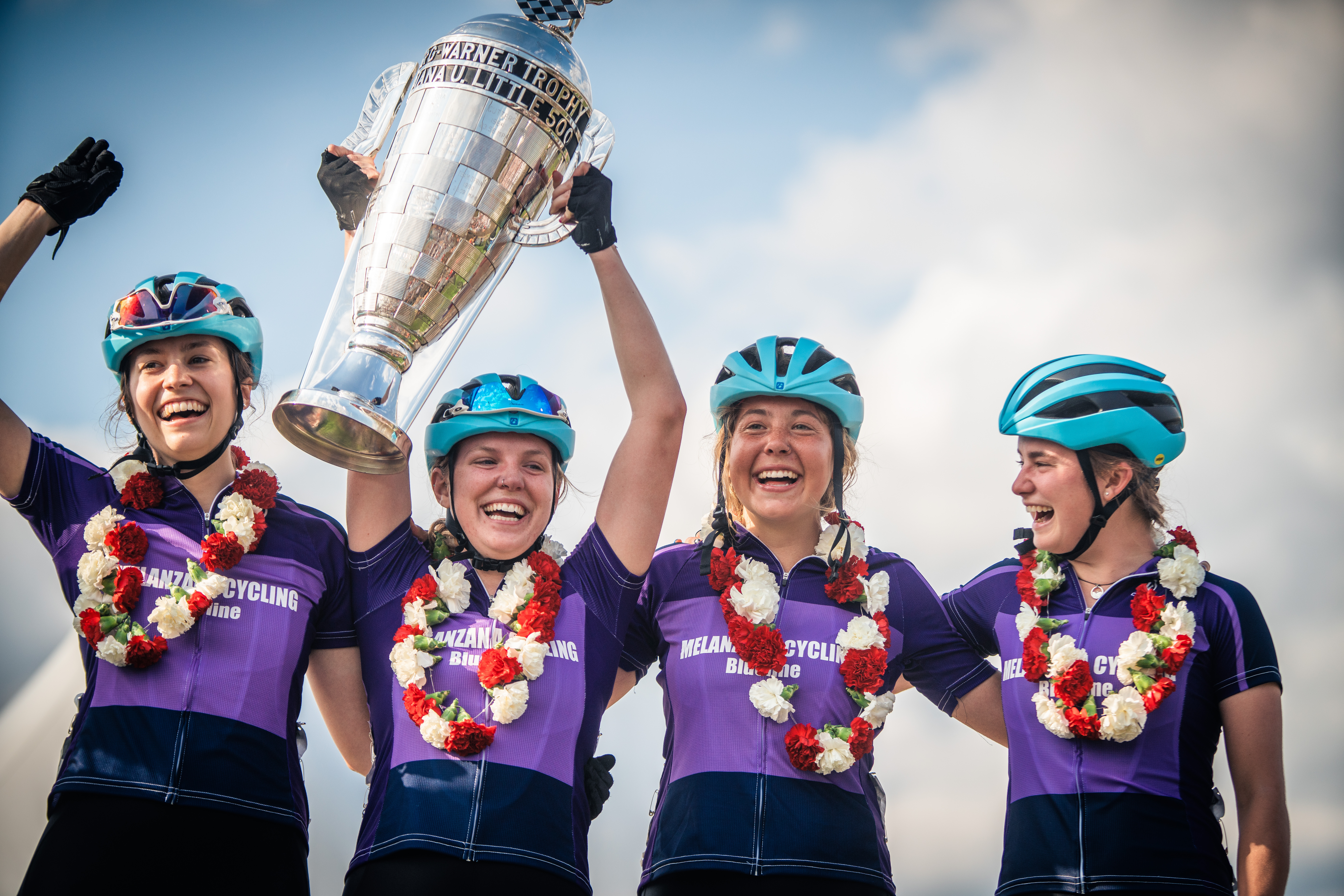 The Melanzana bike team hoists the Little 500 tophy up on the podium after winning the women's Litte 500 at Bill Armstrong Stadium April 22, 2022.