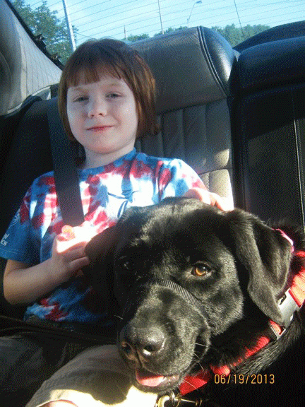 Specially trained service dog lends child and her family a helping paw  